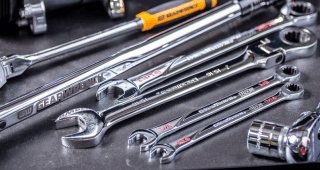 GEARWRENCH ratchets, wrenches, and torque wrenches on work table top