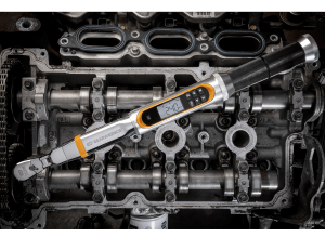 Image of GEARWRENCH 85194 Electronic Torque Wrench in front of an engine block